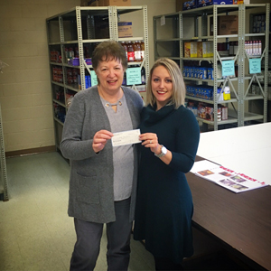 Monroeville Foundation Presents check to local food pantries